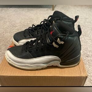 Air Jordan 12 Retro "Playoff" in youth size 6.5Y size 8 in women’s.